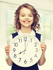 Image showing girl with big clock