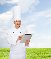 Image showing smiling female chef with tablet pc computer