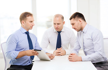 Image showing business team working with tablet pc in office