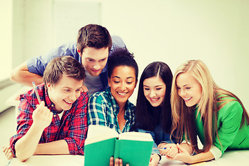 Image showing students reading book at school