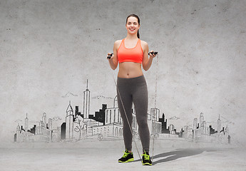 Image showing sporty woman with skipping rope