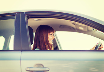 Image showing happy woman driving a car