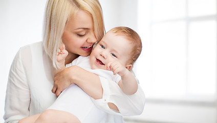 Image showing happy mother with smiling baby