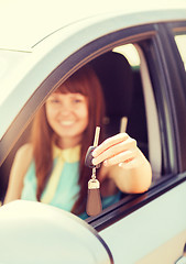 Image showing happy woman holding car key