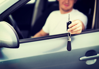 Image showing man with car key outside