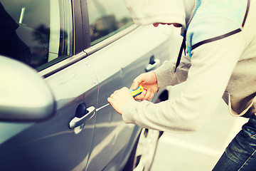 Image showing thief breaking the car lock