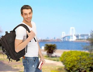 Image showing travelling student with backpack and book