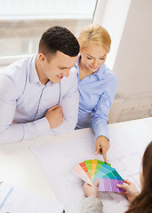 Image showing couple looking at blueprint and color samples