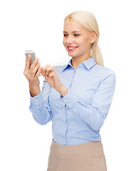 Image showing young smiling businesswoman with smartphone