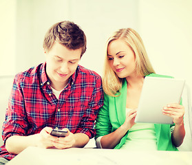 Image showing students using smartphone and tablet pc at school