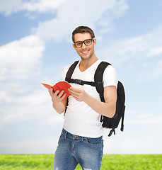 Image showing travelling student with backpack and book