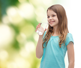 Image showing smiling little girl with glass of water