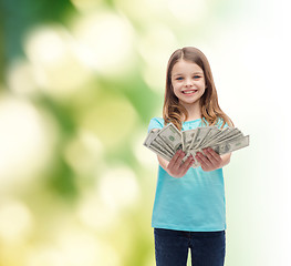 Image showing smiling little girl giving dollar cash money