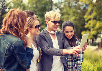 Image showing teenagers taking photo with tablet pc outside