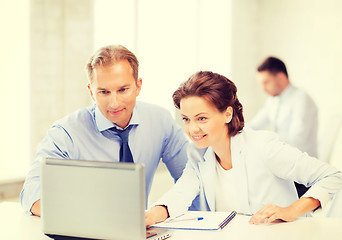 Image showing man and woman working with laptop in office