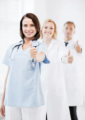 Image showing team of doctors showing thumbs up