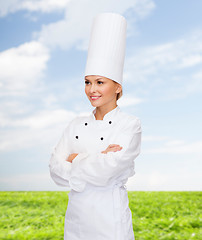 Image showing smiling female chef with crossed arms