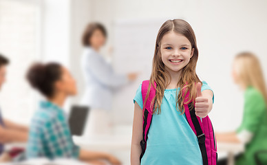 Image showing smiling girl with school bag showing thumbs up