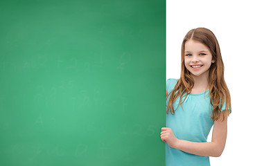 Image showing happy little girl with blank blackboard