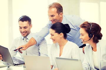 Image showing group of people working in call center