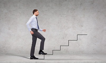 Image showing serious businessman stepping on step