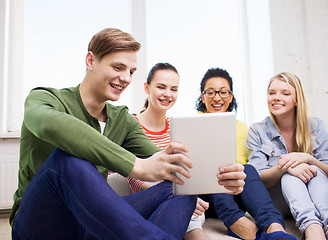 Image showing smiling students making picture with tablet pc