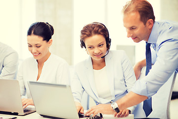 Image showing group of people working in call center