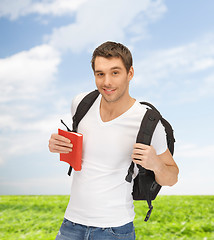 Image showing travelling student with backpack and book