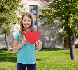 Image showing smiling little girl with red heart