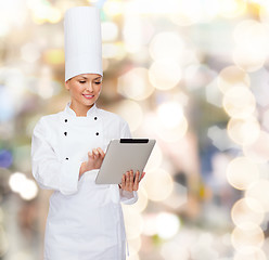 Image showing smiling female chef with tablet pc computer