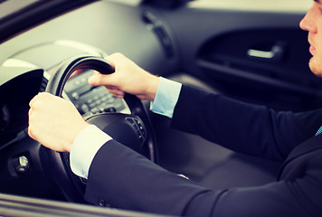Image showing businessman driving a car