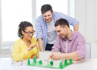 Image showing smiling architects working in office