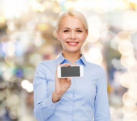 Image showing smiling businesswoman with smartphone blank screen