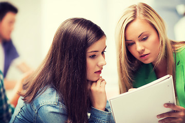 Image showing student girls looking at notebook at school