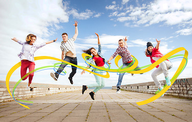 Image showing group of teenagers jumping