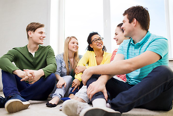 Image showing five smiling teenagers having fun at home