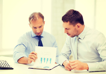 Image showing businessmen with notebook on meeting