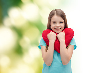 Image showing smiling little girl with red heart