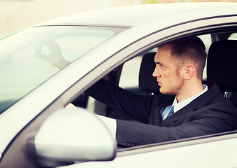 Image showing businessman driving a car