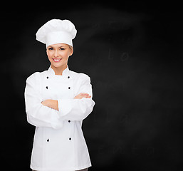 Image showing smiling female chef with crossed arms