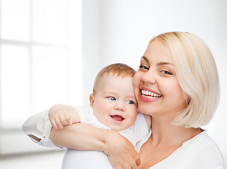 Image showing happy mother with smiling baby