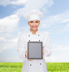 Image showing smiling female chef with tablet pc blank screen