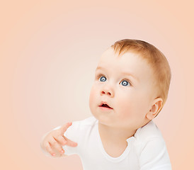 Image showing curious baby looking up