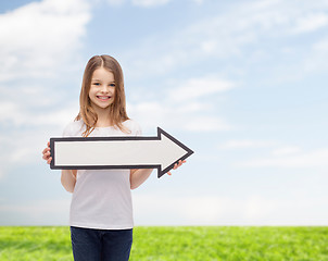 Image showing smiling girl with blank arrow pointing right