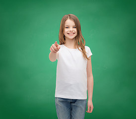 Image showing little girl in blank white t-shirt pointing at you