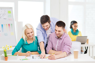 Image showing smiling interior designers working in office