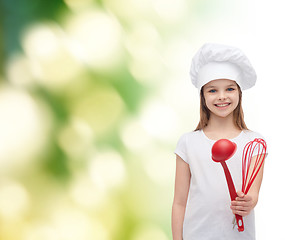 Image showing smiling girl in cook hat with ladle and whisk