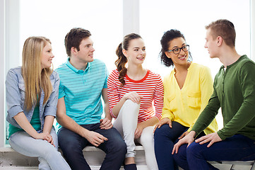 Image showing five smiling teenagers having fun at home