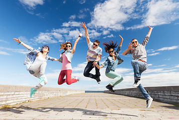 Image showing group of teenagers jumping