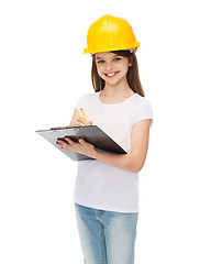 Image showing smiling little girl in protective helmet